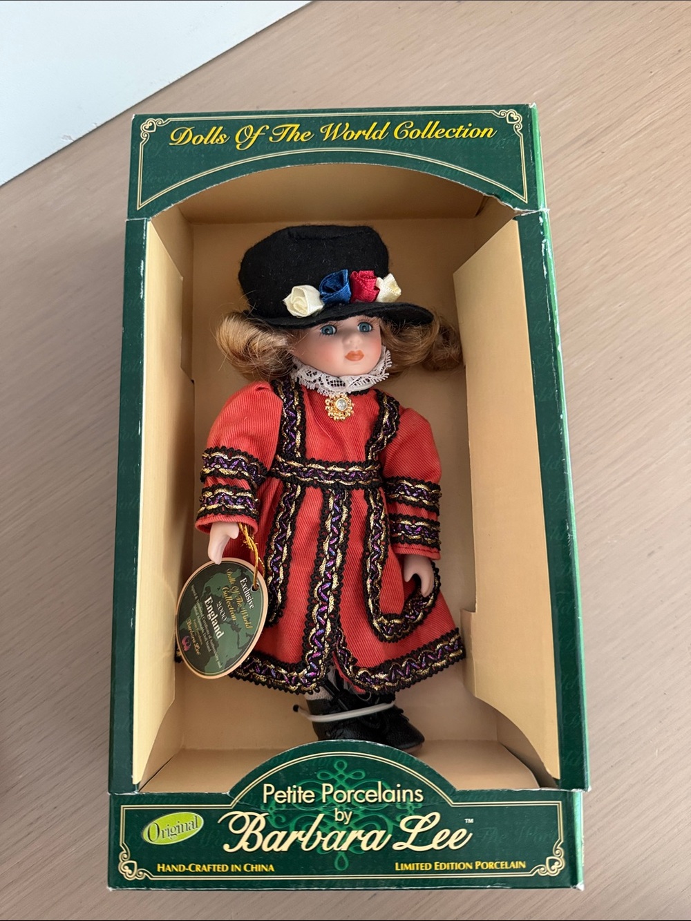 Petite Porcelain Doll in Red Dress and Black Hat